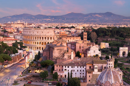 Rome, Italy view towards the Colosseum with archeological areas at sunset.の写真素材