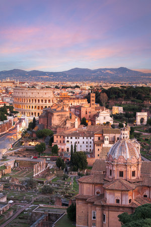 Rome, Italy view towards the Colosseum with archeological areas at sunset.の写真素材