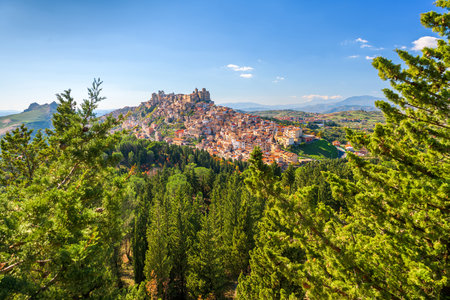 Troina, Sicily, Italy hilltop townscape above the trees.の写真素材