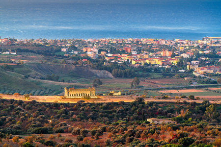 Agrigento, Sicily, Italy cityscape towards the Valley of the Temples and the Mediterranean at dawn.の写真素材