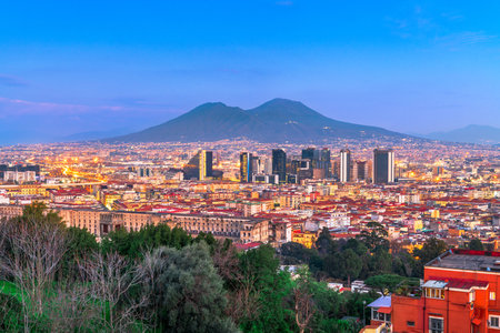 Naples, Italy with the financial district skyline under Mt. Vesuvius at twilight.の写真素材