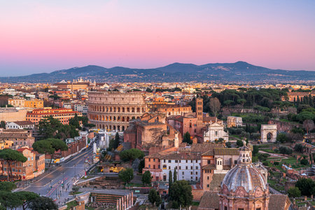 Rome, Italy overlooking the Roman Forum and Colosseum at dusk.の写真素材