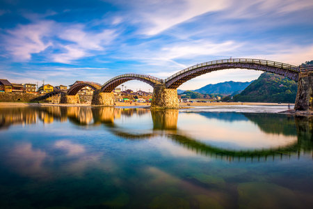 Iwakuni, Yamaguchi, Japan at Kintaikyo Bridge over the Nishiki River at dusk.の写真素材