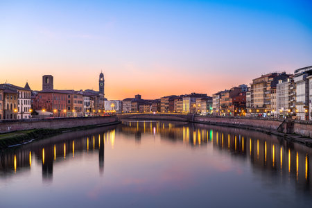 Pisa, Italy skyline on the Arno River at dusk.の写真素材
