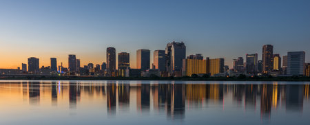 Osaka, Japan skyline at Umeda from across the Yodogawa River in the early morning.の写真素材