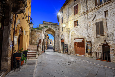 Assisi, Italy at the Roman Gate at twilight.の写真素材