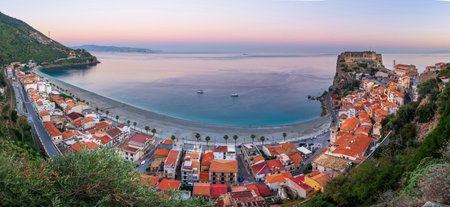 Scilla, Italy on the Mediterranean coast at twilight with seasonal flowers.の写真素材
