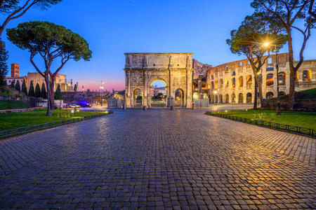 Rome, Italy at the Arch of Constantine and the Colosseum at twilight.の写真素材
