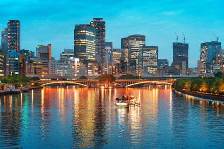 Osaka, Japan cityscape on the Ogawa River at dusk.の写真素材