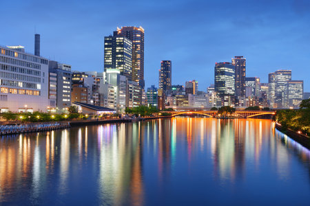 Osaka, Japan cityscape on the river at dusk.の写真素材
