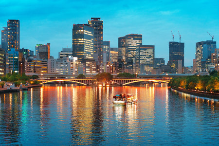 Osaka, Japan cityscape on the Ogawa River at dusk.の写真素材