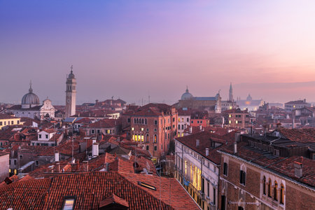 Venice; Italy rooftop skyline towards San Giorgio dei Greci and its leaning bell tower.の写真素材