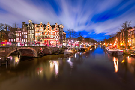 Amsterdam, Netherlands bridges and canals at twilight.の写真素材