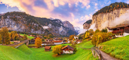 Lauterbrunnen, Switzerland beautiful morning panorama during autumn season.の写真素材