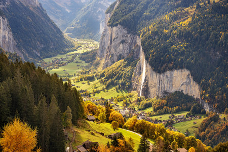 Lauterbrunnen, Switzerland valley from Wengen in the fall season with Staubbach Falls.の写真素材