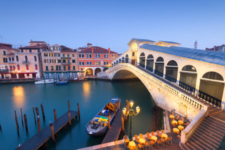 Venice, Italy at the Rialto Bridge over the Grand Canal at twilight.の写真素材