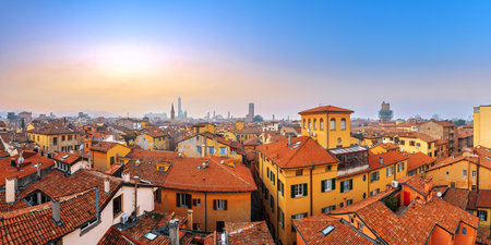 Bologna, Italy rooftop skyline and famous historic towers at dusk.の写真素材
