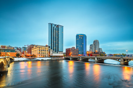 Grand Rapids, Michigan, USA downtown skyline on the Grand River at dusk.の写真素材