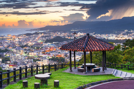 Nago, Okinawa, Japan downtown cityscape at twilight from the park.の写真素材