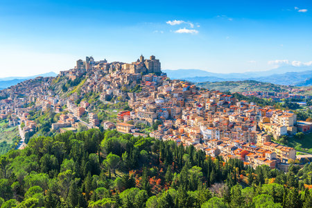 Troina, Sicily, Italy hilltop townscape above the trees.の写真素材