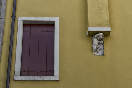 Statue of cherub that raises the flueの写真素材