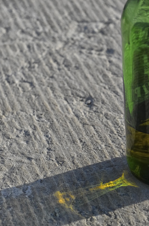 View of colorful shadow of bottle on the rockの写真素材