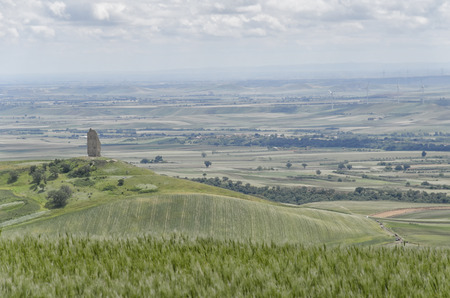 View of the ancient ruined tower of Montecorvinoの写真素材