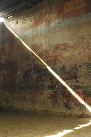 Ray of sunshine on a Roman frescoの写真素材