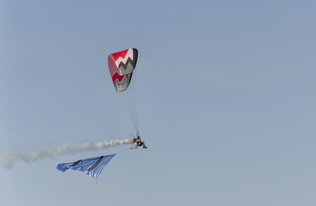 Bellaria, Italy - June 05, 2016: View of a man piloting a paramotor
