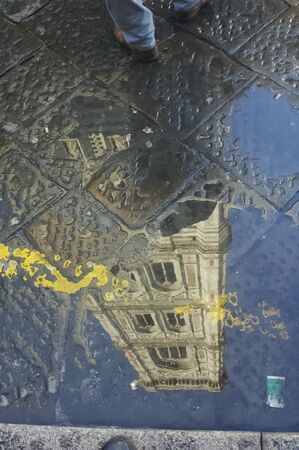 Reflection of Giotto campanile in a puddleの写真素材