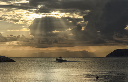 View of rubber dinghy returning to portの写真素材