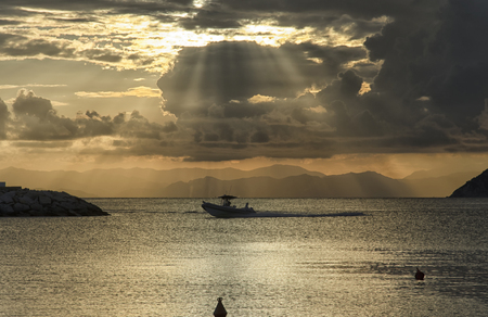 View of rubber dinghy returning to harborの写真素材