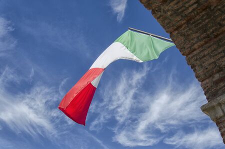 View of the Italian flag with clouds in the backgroundの写真素材