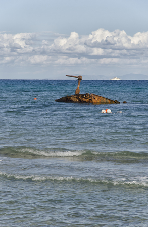 View of an old sunken rusty shipの写真素材