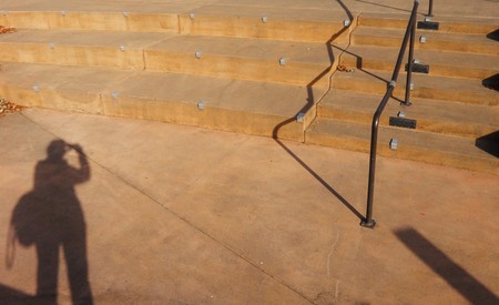 Shadow of human and bar at the plazaの写真素材