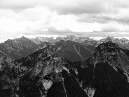 Storm clouds approaching a peak of the North Cascadesの写真素材