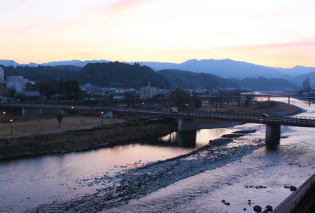 Kuma River flows through the historic town at twilightの写真素材
