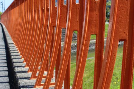 Orange painted a bridge guardrailの写真素材