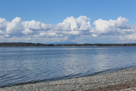 Tides move in Birch Bay under spring clouds