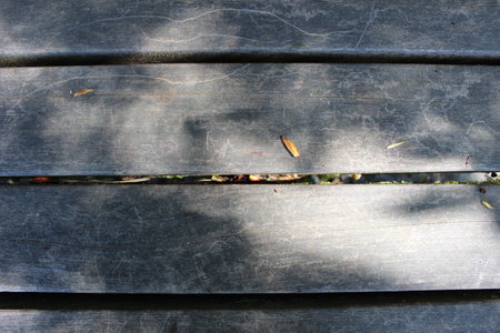 A weathered park bench surface close upの写真素材