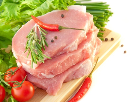 Tomatoes, an onion, pepper and meat on a white backgroundの写真素材