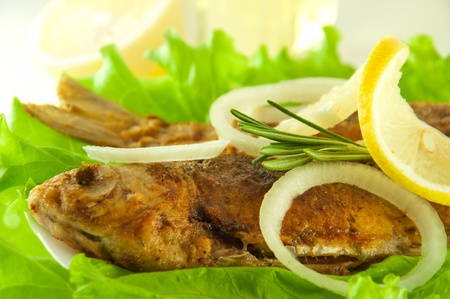 Fish fried, a crucian with a lemon, rosemary and olive oilの写真素材