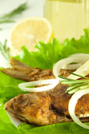 Fish fried, a crucian with a lemon, rosemary and olive oilの写真素材
