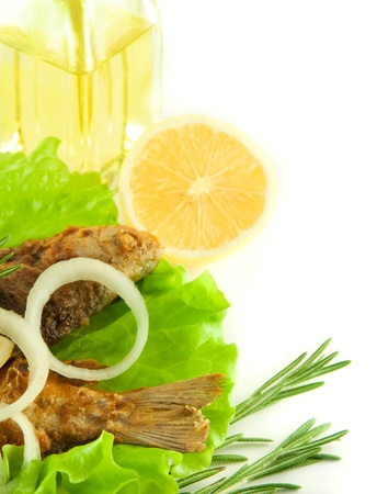 Fish fried, a crucian with a lemon, rosemary and olive oilの写真素材