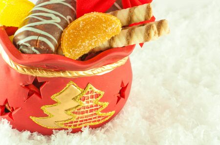 Christmas bag with gifts, cookies and fruit candy, a giftの写真素材