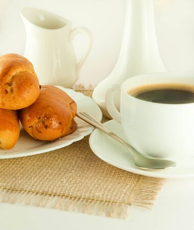 Fresh pies and cup of fragrant coffee on a white backgroundの写真素材