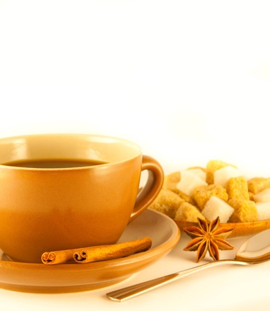 Cup of coffee with chocolates, coffee grains with cinnamon and an aniseの写真素材