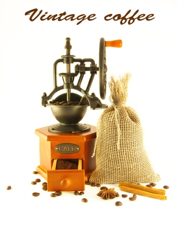 Coffee grinder in a retro style with a bag and coffee grainsの写真素材