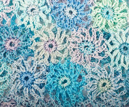 Flower ornament connected by a hook, a knitted fabricの写真素材