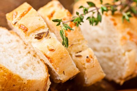 Fresh bread and butter on a wooden board